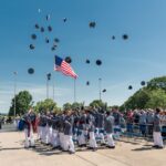 Riverside Military Academy cadets throwing their hats in the air on Commencement Day