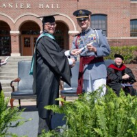 Jacob receives his diploma from the dean of Riverside Military Academy in his parade dress uniform on Commencement Day. Riverside Military Academy cadet receiving his diploma from the Academic Dean in parade dress